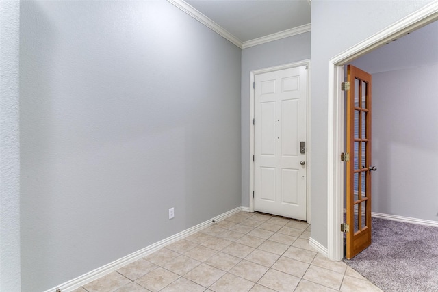 foyer featuring ornamental molding and light tile patterned flooring