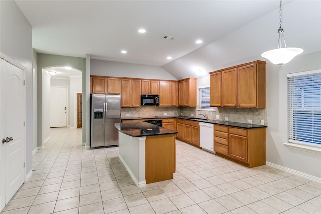 kitchen featuring sink, a center island, stainless steel fridge with ice dispenser, white dishwasher, and pendant lighting