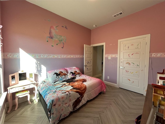 bedroom with parquet flooring