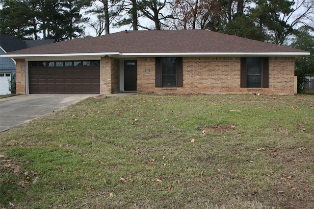 ranch-style house with a front yard and a garage