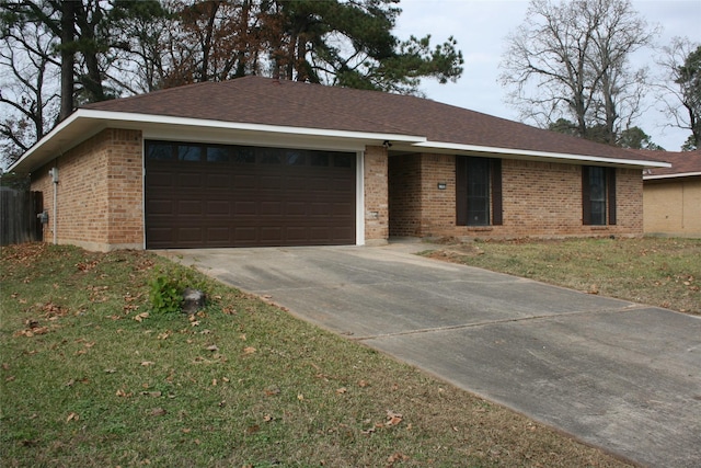 ranch-style house with a front yard and a garage