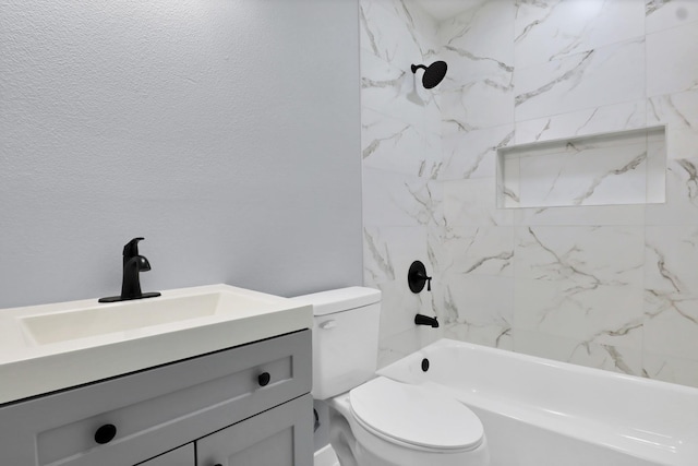 full bath featuring bathtub / shower combination, a textured wall, vanity, and toilet