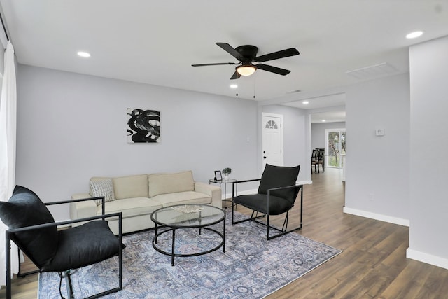 living room with ceiling fan, recessed lighting, dark wood-type flooring, visible vents, and baseboards