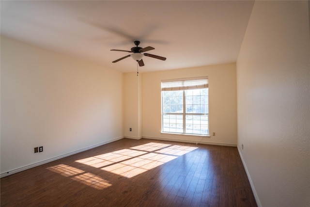 unfurnished room featuring dark hardwood / wood-style flooring and ceiling fan