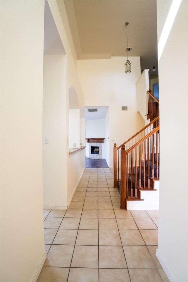 hall with light tile patterned floors