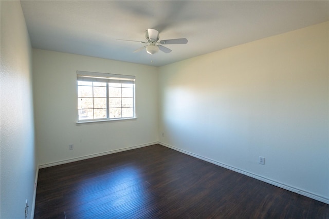 unfurnished room with dark hardwood / wood-style floors and ceiling fan