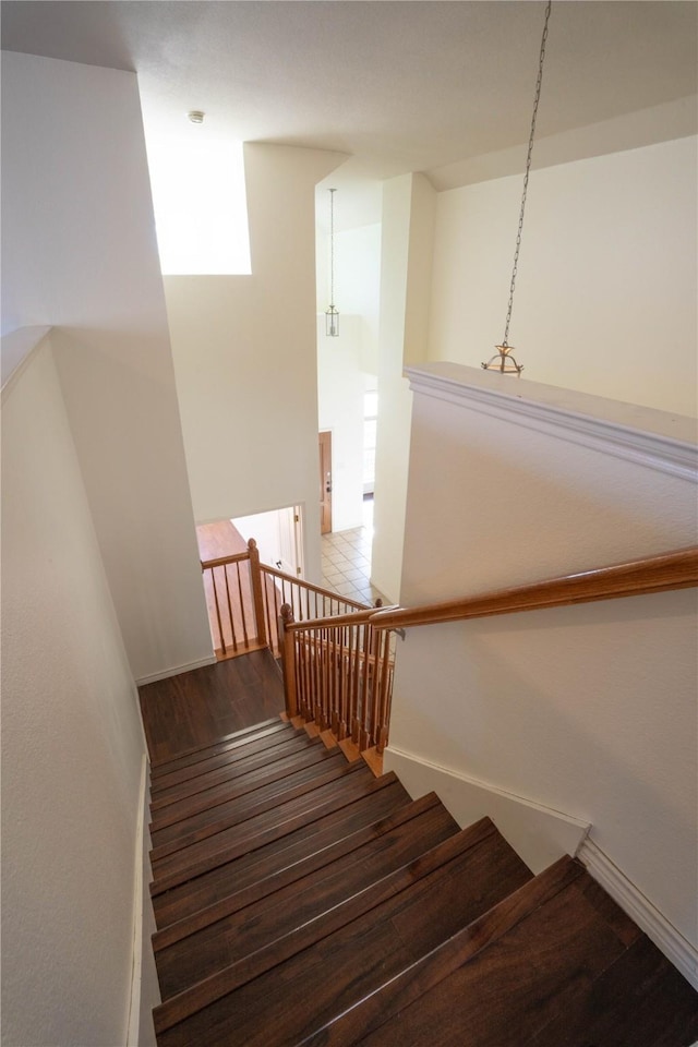 stairway featuring hardwood / wood-style flooring