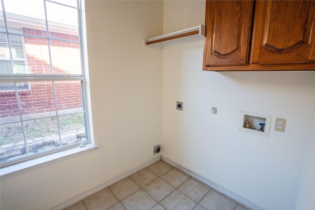 laundry area with electric dryer hookup, cabinets, gas dryer hookup, hookup for a washing machine, and light tile patterned floors