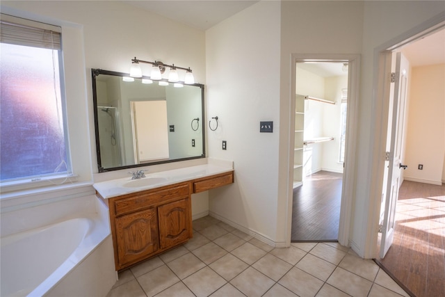 bathroom featuring tile patterned floors, plenty of natural light, and vanity