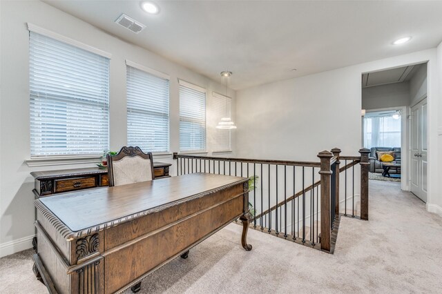 living room with ceiling fan and light carpet