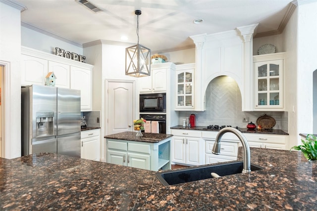 kitchen with black appliances, a center island, white cabinets, and tasteful backsplash