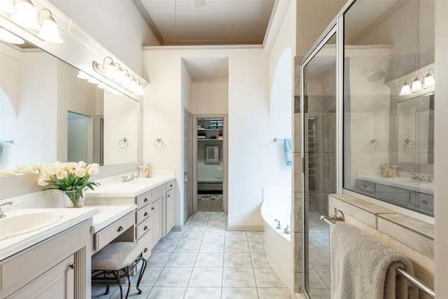 bathroom featuring tile patterned floors, vanity, ornamental molding, and independent shower and bath