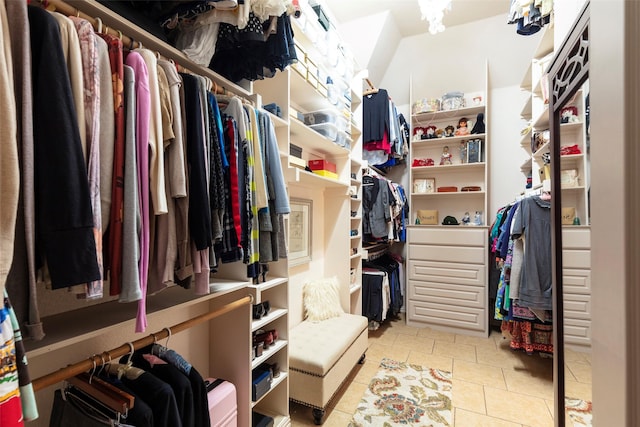 spacious closet featuring light tile patterned floors