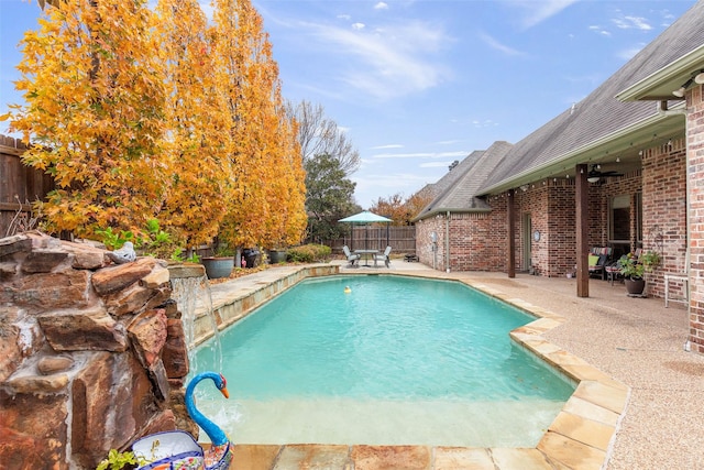 view of pool featuring ceiling fan and a patio area