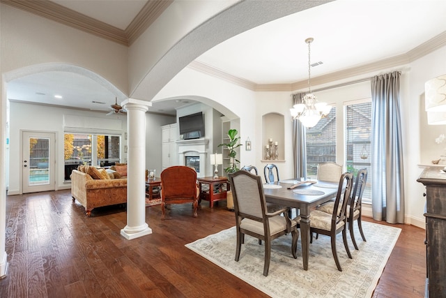 dining area featuring crown molding, plenty of natural light, and ceiling fan with notable chandelier