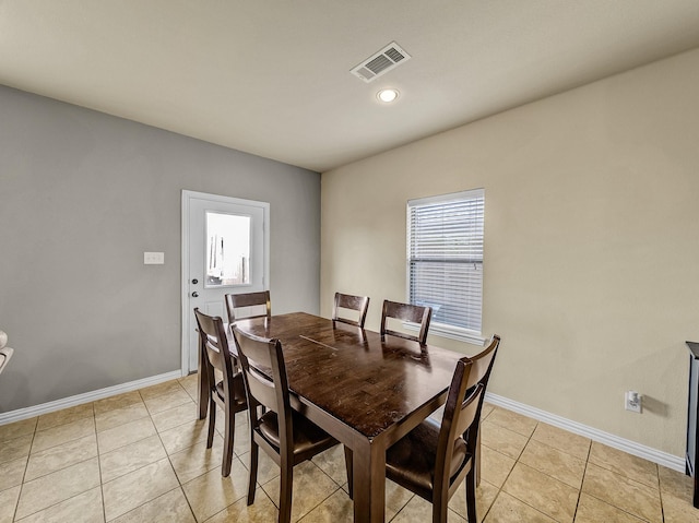 dining space featuring visible vents, baseboards, and light tile patterned floors