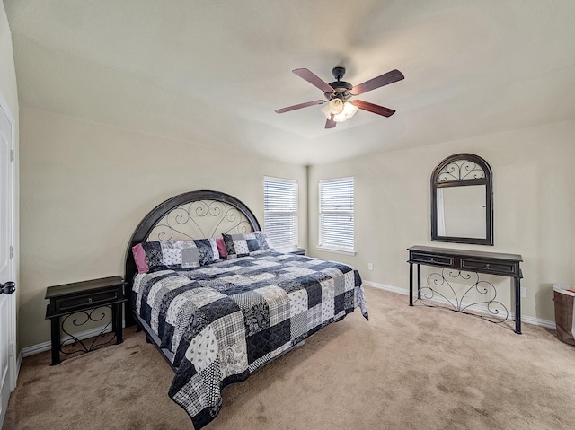 bedroom with light carpet and ceiling fan