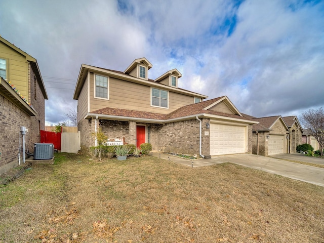 view of front facade featuring a garage, central AC unit, and a front lawn