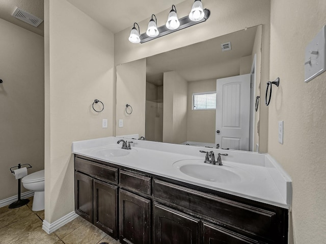 full bathroom featuring visible vents, a sink, and toilet