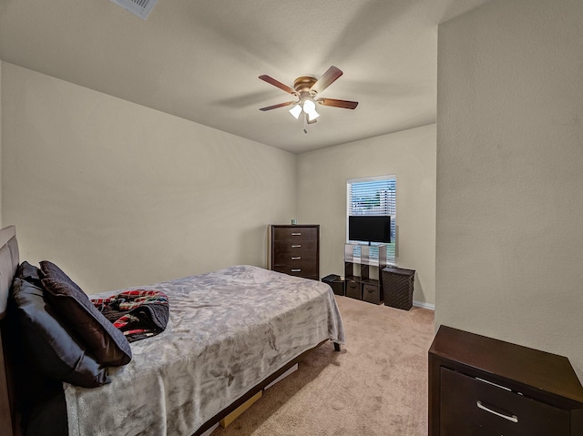 bedroom featuring light carpet, ceiling fan, and visible vents