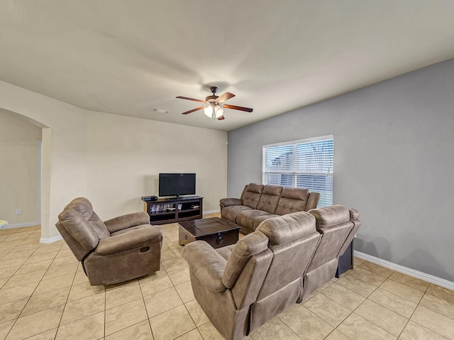 tiled living room featuring ceiling fan