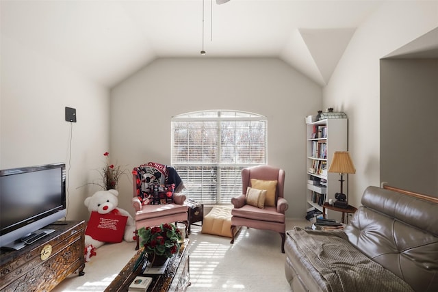 carpeted living room with lofted ceiling