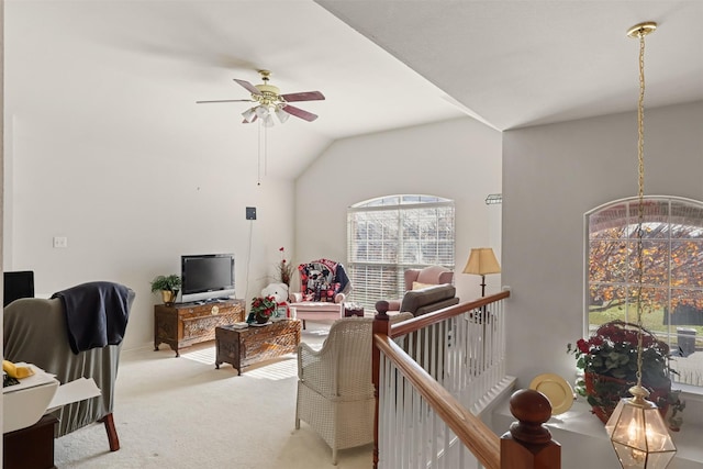 carpeted living room featuring lofted ceiling and ceiling fan