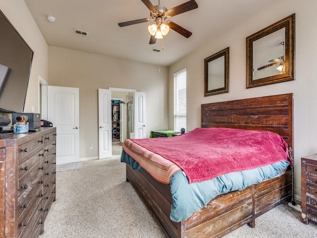 bedroom featuring ceiling fan and light colored carpet