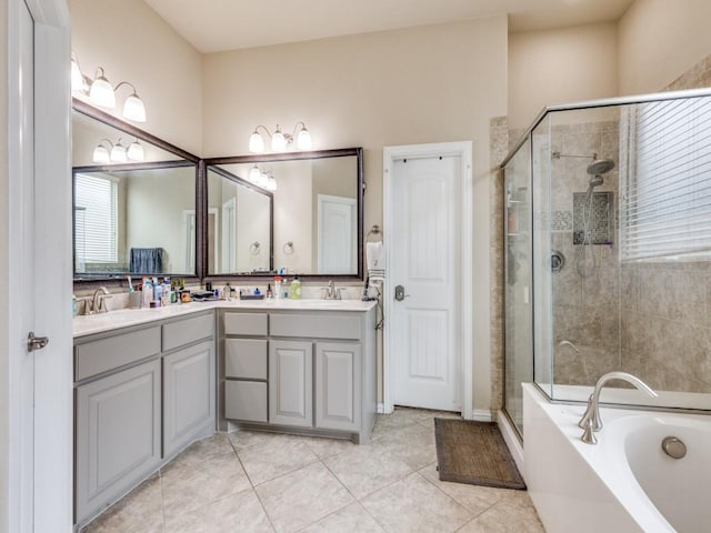 bathroom with tile patterned flooring, vanity, and separate shower and tub