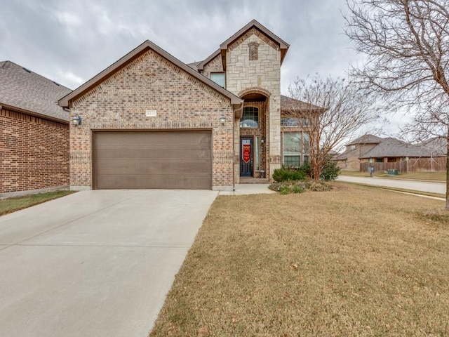 view of front of home featuring a garage and a front yard