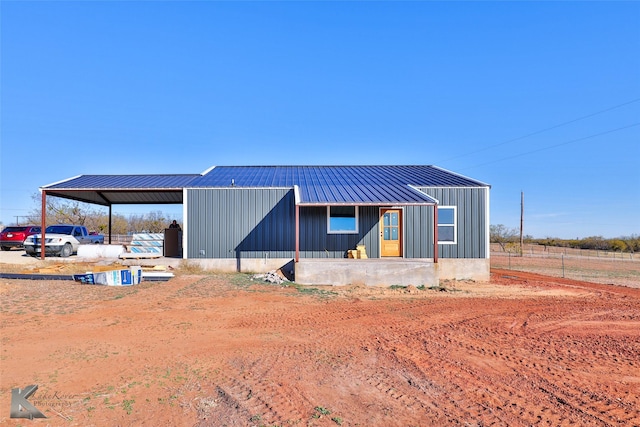 exterior space with a carport