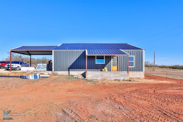 view of front of property featuring a carport