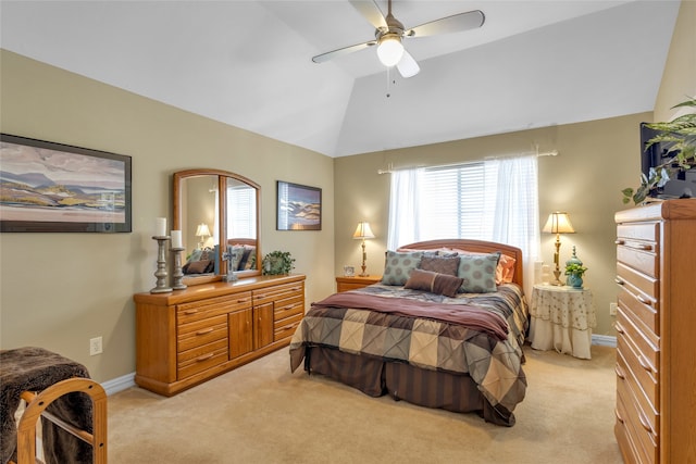 bedroom featuring lofted ceiling, light colored carpet, ceiling fan, and baseboards