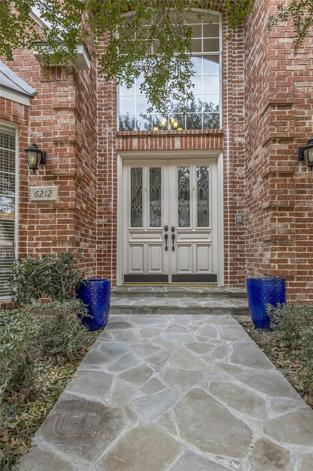 entrance to property with french doors and brick siding