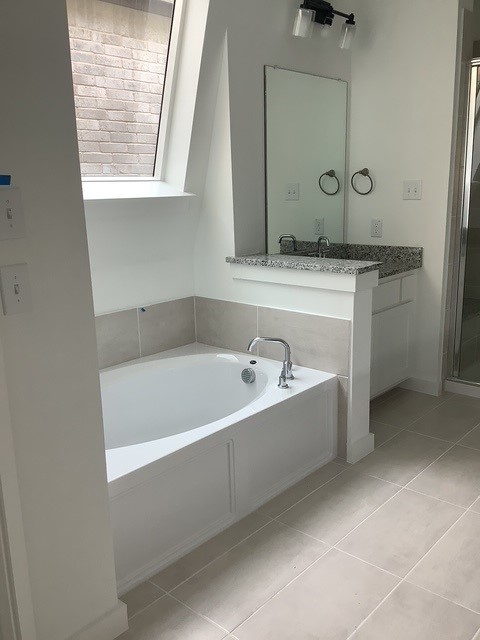 bathroom with vanity, tile patterned floors, and independent shower and bath