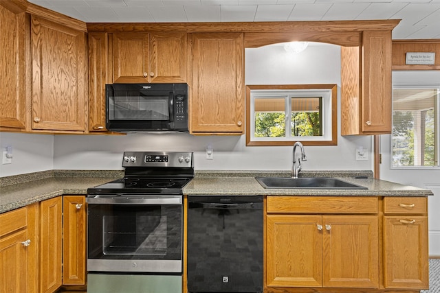 kitchen featuring sink and black appliances