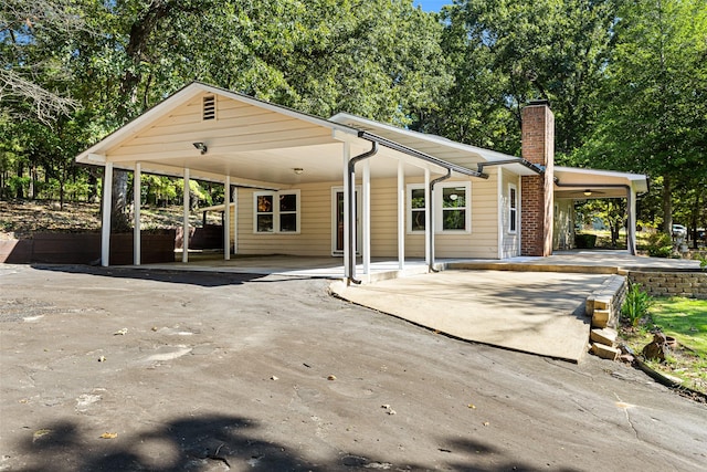 view of front of home featuring a carport