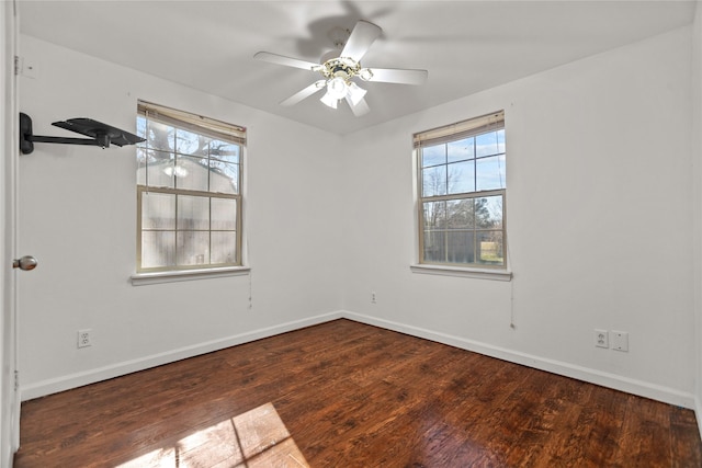 unfurnished room featuring ceiling fan and dark hardwood / wood-style flooring