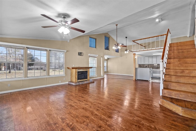 unfurnished living room featuring high vaulted ceiling, hardwood / wood-style floors, and ceiling fan