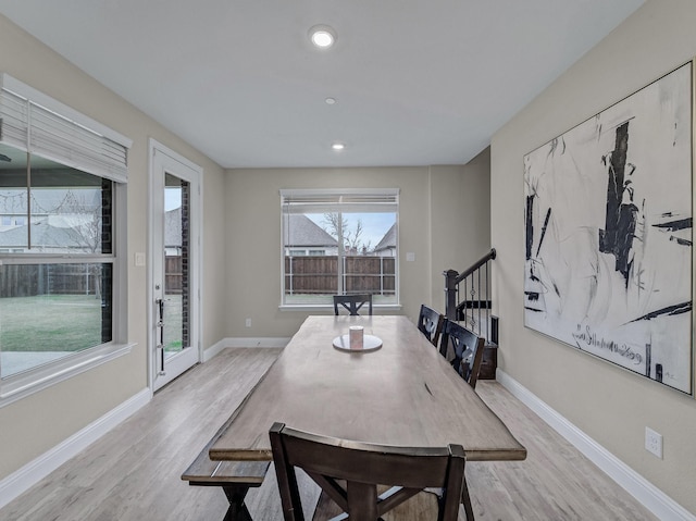 dining area featuring light wood-type flooring