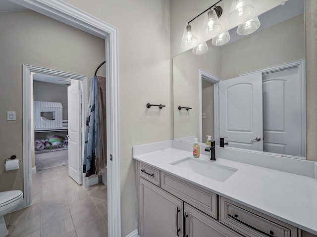 bathroom featuring a shower with curtain, vanity, and toilet