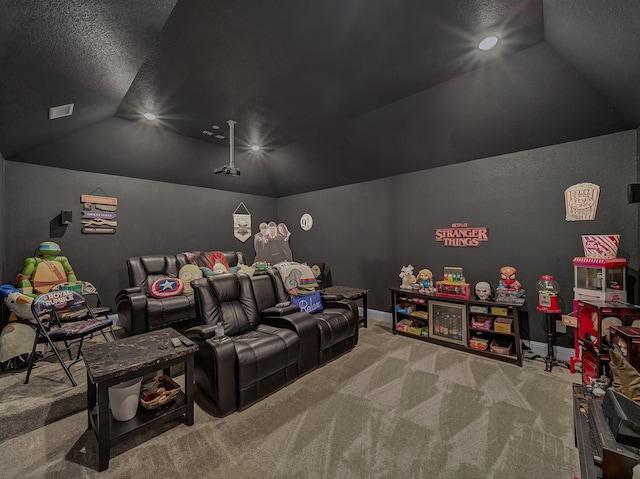 carpeted home theater room featuring lofted ceiling