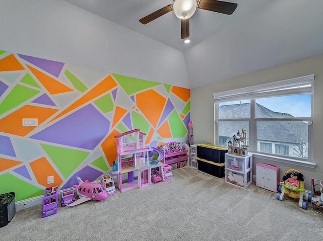 playroom featuring carpet flooring, ceiling fan, and lofted ceiling