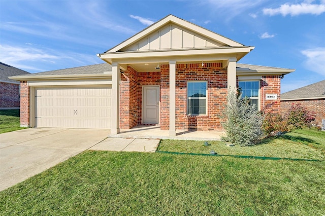 view of front of property with a garage and a front yard