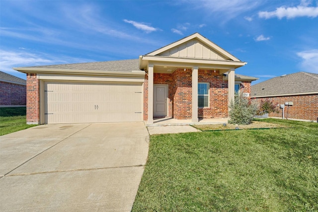 view of front facade with a front yard and a garage