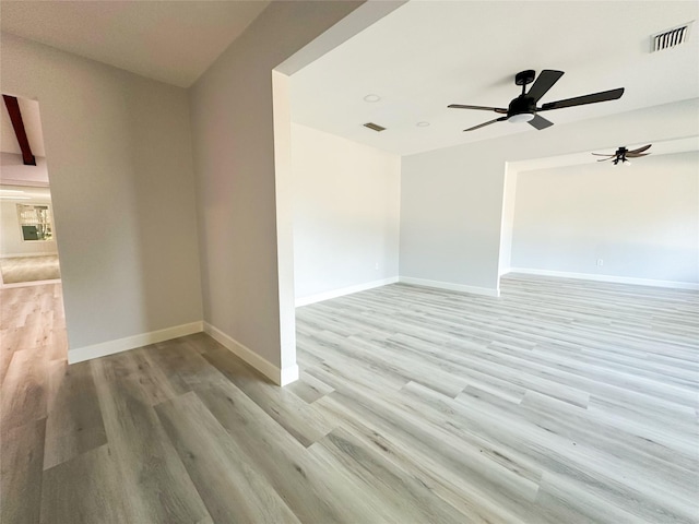 unfurnished room with ceiling fan and light hardwood / wood-style flooring