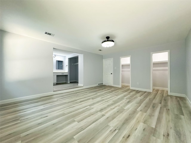 spare room featuring light wood-type flooring