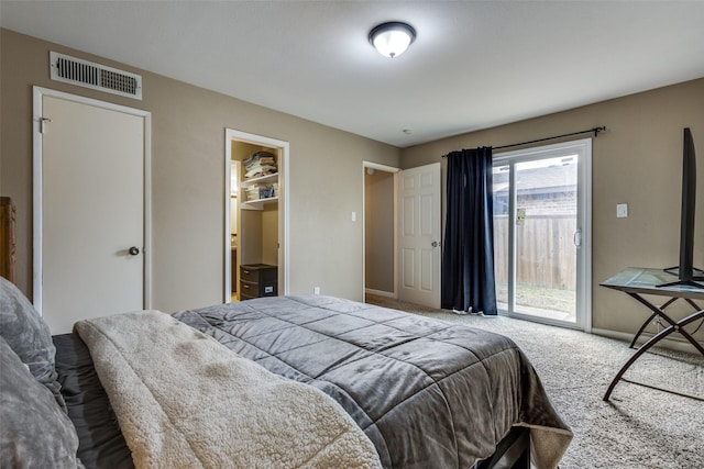 bedroom with carpet floors and access to exterior