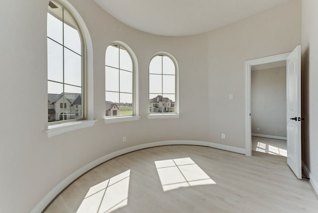 unfurnished room with light hardwood / wood-style flooring