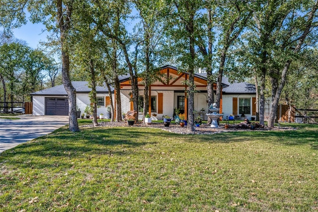 view of front of property with a garage and a front yard